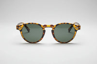Leopard with green lenses