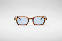 Leopard with blue lenses