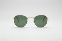 Gold with green lenses